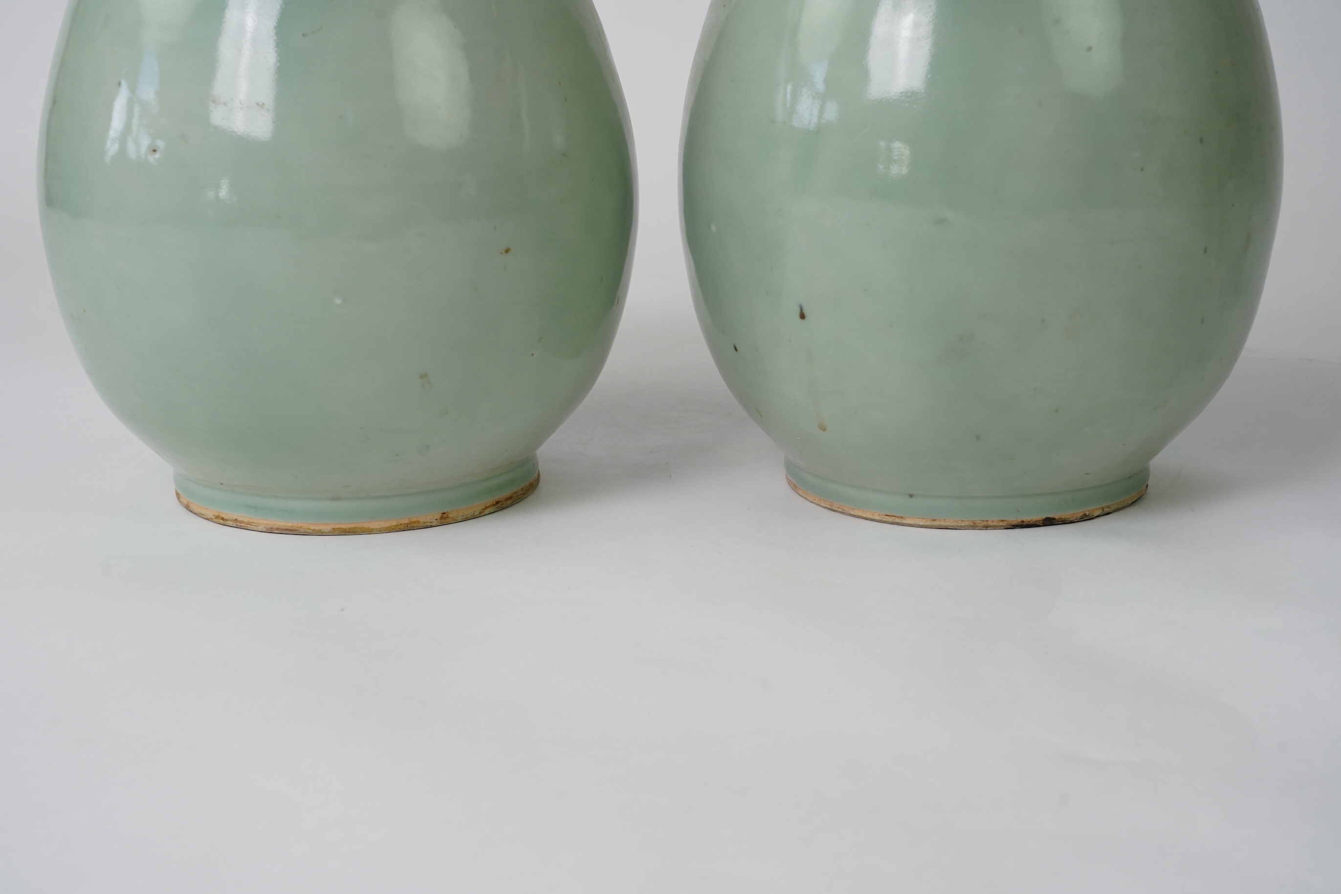 A pair of large Chinese celadon glazed ‘ hu’ vases, Yongzheng seal mark, 19th century